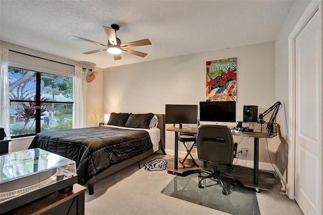 18366 Lake Bend Dr, Jupiter, FL 33458 - bedroom with light carpet, an office area, a textured ceiling, and ceiling fan