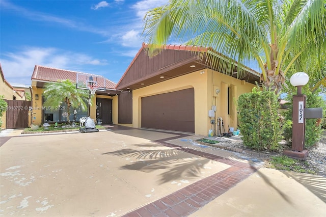 1057 NE 202nd Ln, Miami, FL 33179 - multi unit property featuring stucco siding, driveway, a tiled roof, and a garage