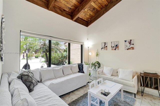 1057 NE 202nd Ln, Miami, FL 33179 - living area with wood ceiling with exposed beams, light marble finish floors, and high vaulted ceiling