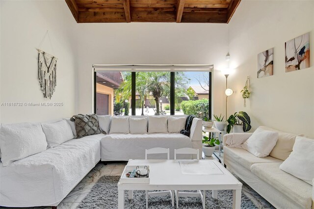 1057 NE 202nd Ln, Miami, FL 33179 - living room with wood ceiling with exposed beams and marble finish flooring