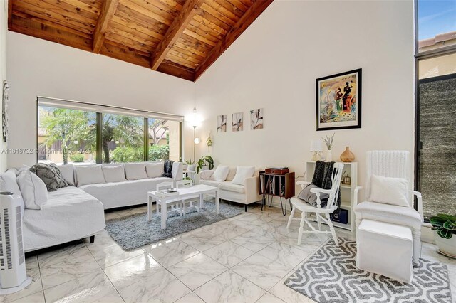 1057 NE 202nd Ln, Miami, FL 33179 - living area featuring marble finish flooring, wooden ceiling with exposed beams, and high vaulted ceiling