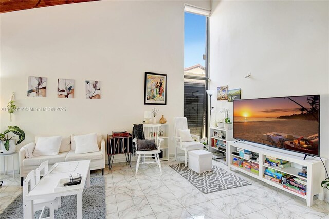 1057 NE 202nd Ln, Miami, FL 33179 - living area featuring marble look tiles