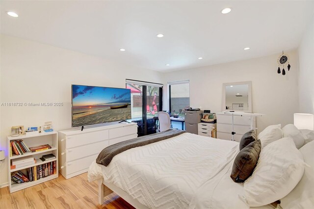 1057 NE 202nd Ln, Miami, FL 33179 - bedroom featuring light wood-style flooring and recessed lighting