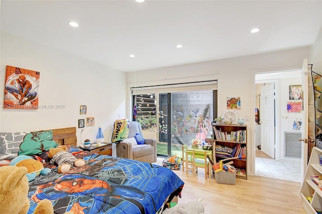 1057 NE 202nd Ln, Miami, FL 33179 - bedroom featuring access to exterior, recessed lighting, and wood finished floors