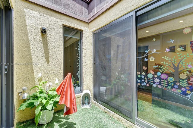 1057 NE 202nd Ln, Miami, FL 33179 - entrance to property with stucco siding