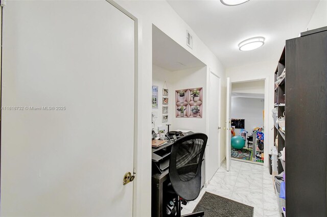 1057 NE 202nd Ln, Miami, FL 33179 - home office featuring light marble finish flooring