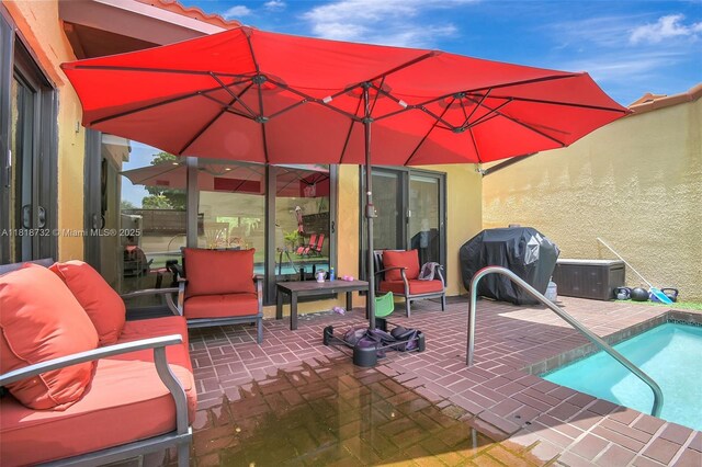 1057 NE 202nd Ln, Miami, FL 33179 - view of patio featuring area for grilling and an outdoor pool