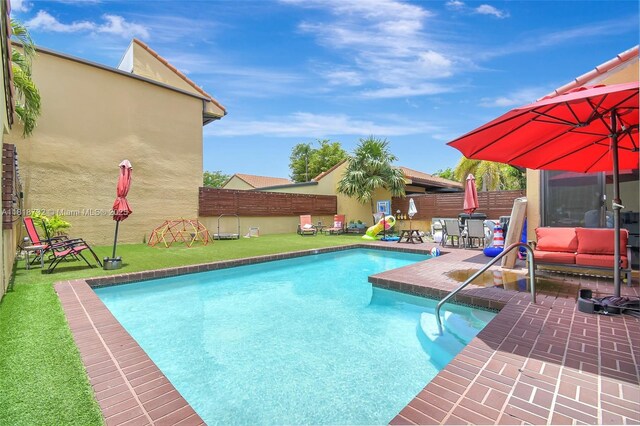 1057 NE 202nd Ln, Miami, FL 33179 - view of swimming pool featuring a fenced backyard and a patio