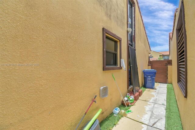 1057 NE 202nd Ln, Miami, FL 33179 - view of side of home featuring stucco siding
