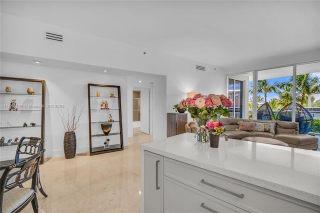 400 Alton Rd Unit 407, Miami Beach, FL 33139 - kitchen with open floor plan, light stone countertops, and recessed lighting