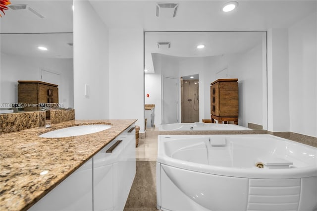 400 Alton Rd Unit 407, Miami Beach, FL 33139 - bathroom featuring a shower stall, a whirlpool tub, vanity, and recessed lighting