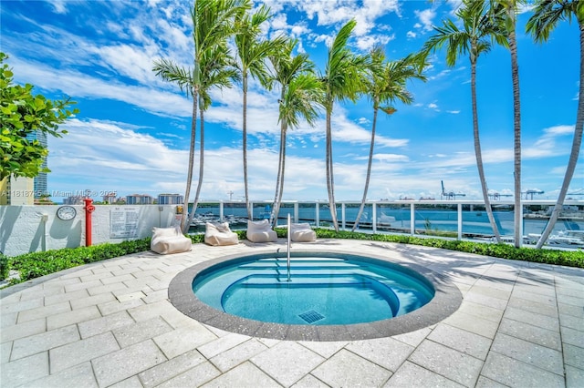 400 Alton Rd Unit 407, Miami Beach, FL 33139 - view of swimming pool featuring a hot tub and a water view