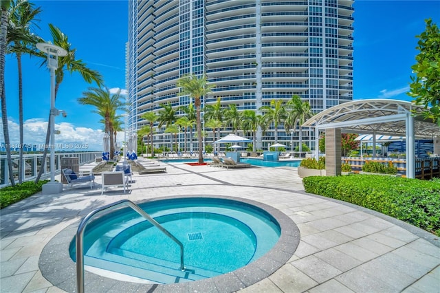 400 Alton Rd Unit 407, Miami Beach, FL 33139 - community pool featuring a hot tub and a patio