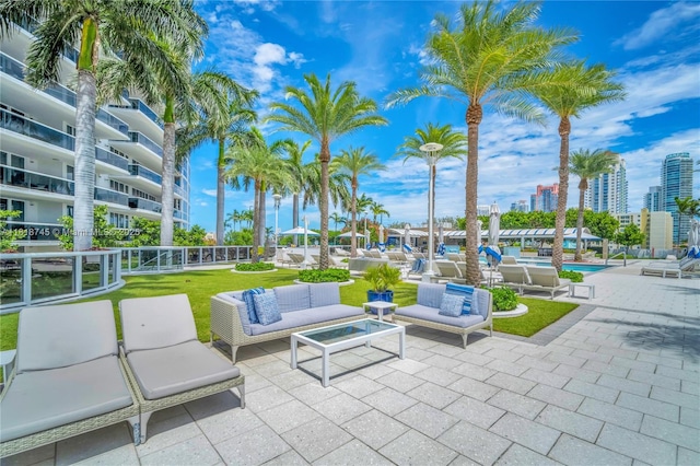 400 Alton Rd Unit 407, Miami Beach, FL 33139 - view of patio / terrace with outdoor lounge area and a community pool