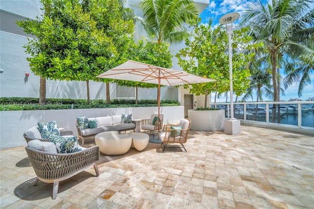 400 Alton Rd Unit 407, Miami Beach, FL 33139 - view of patio / terrace with an outdoor hangout area and a water view