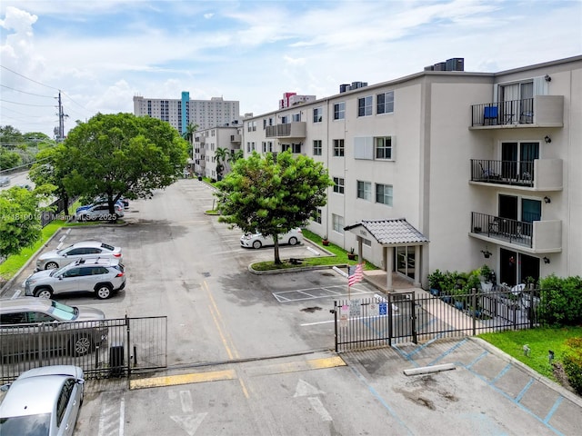 5501 NW 7th St Unit E408, Miami, FL 33126 - view of apartment building / complex featuring uncovered parking