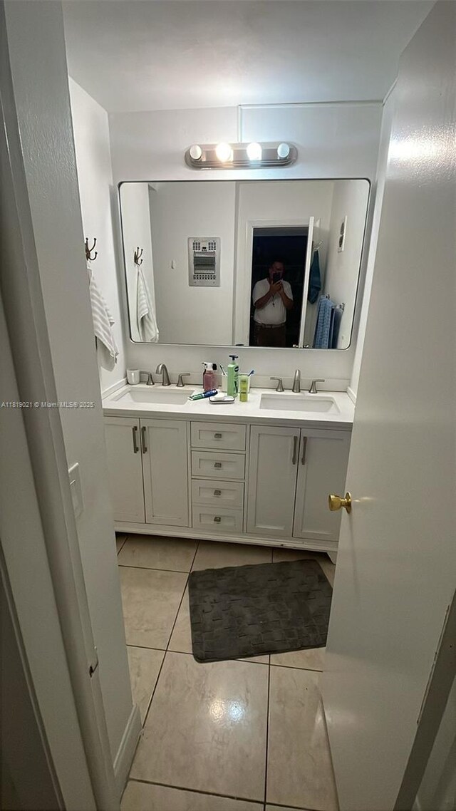 215 SE 3rd Ave Unit 106C, Hallandale Beach, FL 33009 - bathroom featuring double vanity and tile patterned floors