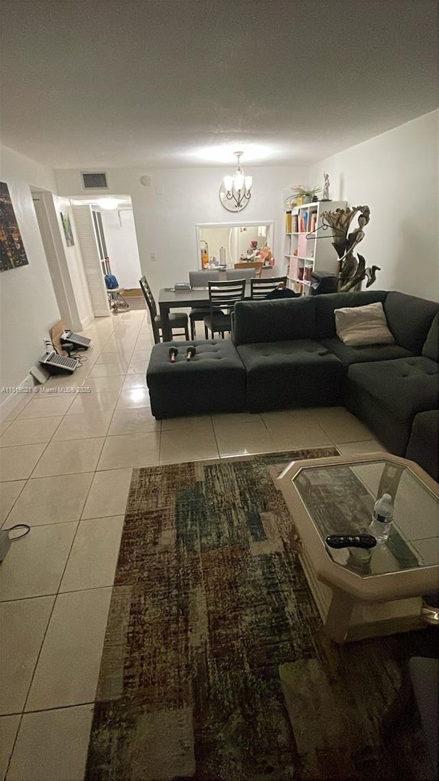 215 SE 3rd Ave Unit 106C, Hallandale Beach, FL 33009 - tiled living room with a chandelier