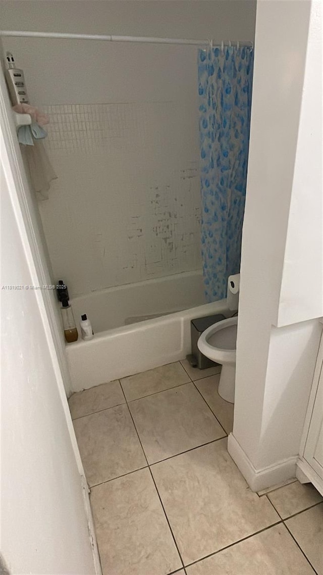 215 SE 3rd Ave Unit 106C, Hallandale Beach, FL 33009 - full bath with tile patterned flooring, shower / tub combo, and toilet