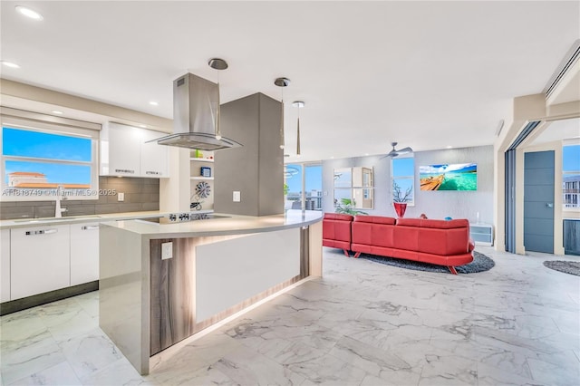 3015 N Ocean Blvd Unit 17A, Fort Lauderdale, FL 33308 - kitchen with island exhaust hood, white cabinets, light countertops, modern cabinets, and recessed lighting