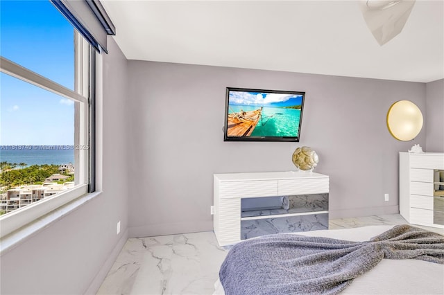 3015 N Ocean Blvd Unit 17A, Fort Lauderdale, FL 33308 - bedroom featuring marble look tiles, multiple windows, a water view, and a glass covered fireplace