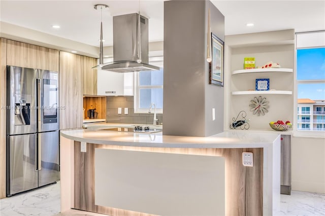 3015 N Ocean Blvd Unit 17A, Fort Lauderdale, FL 33308 - kitchen with stainless steel fridge, light marble finish floors, modern cabinets, island exhaust hood, and light countertops
