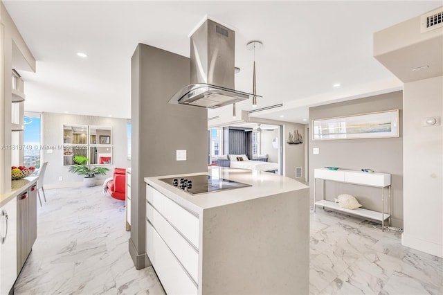 3015 N Ocean Blvd Unit 17A, Fort Lauderdale, FL 33308 - kitchen with island range hood, black electric stovetop, modern cabinets, white cabinets, and recessed lighting