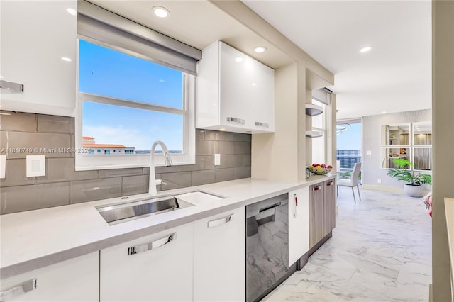 3015 N Ocean Blvd Unit 17A, Fort Lauderdale, FL 33308 - kitchen featuring stainless steel dishwasher, white cabinets, light marble finish floors, modern cabinets, and recessed lighting