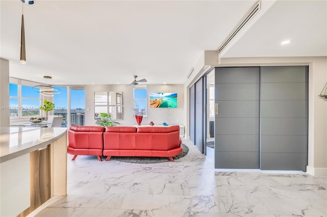 3015 N Ocean Blvd Unit 17A, Fort Lauderdale, FL 33308 - living area with ceiling fan, marble finish floors, and recessed lighting