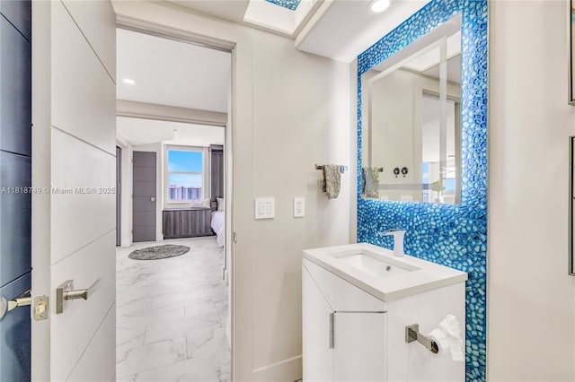 3015 N Ocean Blvd Unit 17A, Fort Lauderdale, FL 33308 - ensuite bathroom with marble look tile flooring, vanity, and tasteful backsplash