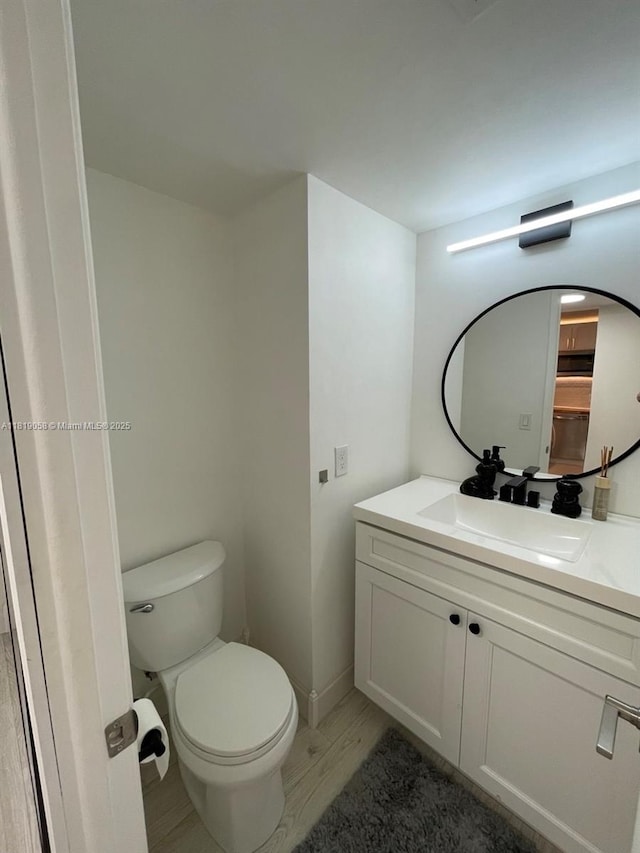 2801 NE 183rd St Unit 1611W, Aventura, FL 33160 - bathroom featuring vanity, toilet, and wood finished floors