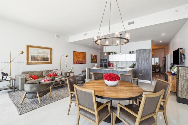 480 NE 31st St Unit Ph5303, Miami, FL 33137 - dining space with a chandelier and light tile patterned floors