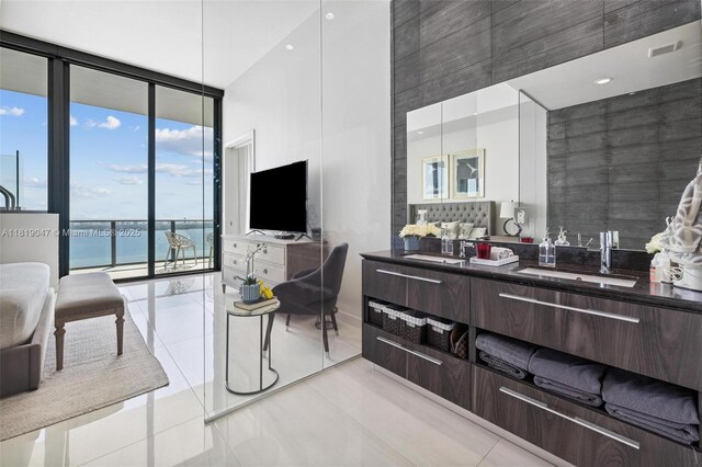 480 NE 31st St Unit Ph5303, Miami, FL 33137 - bathroom with a wall of windows, tile patterned flooring, a high ceiling, and vanity
