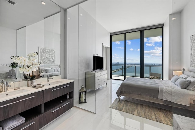 480 NE 31st St Unit Ph5303, Miami, FL 33137 - bedroom with expansive windows and access to exterior