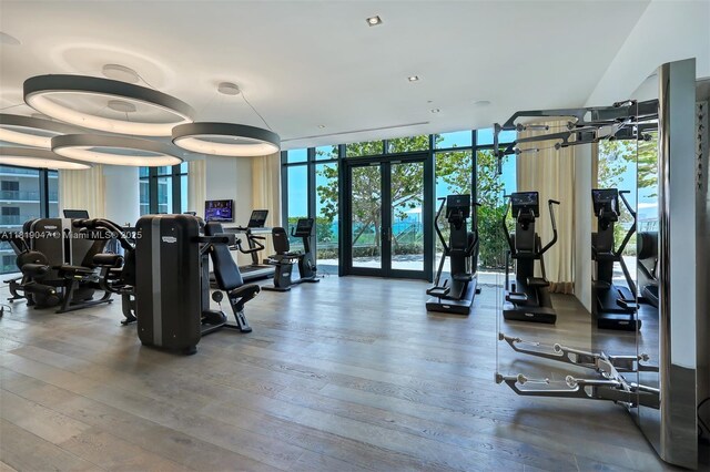 480 NE 31st St Unit Ph5303, Miami, FL 33137 - exercise room featuring a wall of windows and wood finished floors