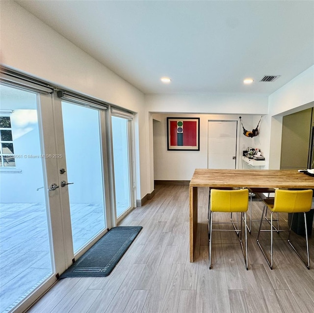 7650 SW 78th Ct, Miami, FL 33143 - bar area featuring wood finished floors, plenty of natural light, french doors, and recessed lighting