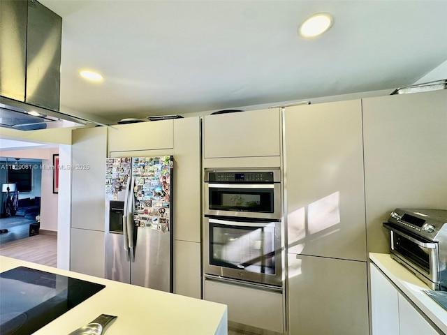 7650 SW 78th Ct, Miami, FL 33143 - kitchen featuring stainless steel appliances, light countertops, recessed lighting, white cabinets, and modern cabinets