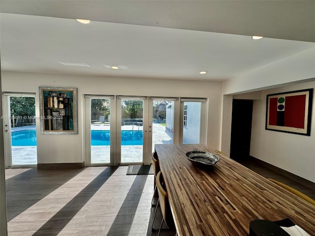 7650 SW 78th Ct, Miami, FL 33143 - dining space featuring french doors, healthy amount of natural light, recessed lighting, and dark wood-style floors