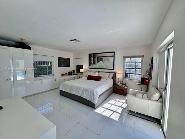7650 SW 78th Ct, Miami, FL 33143 - bedroom with light tile patterned flooring
