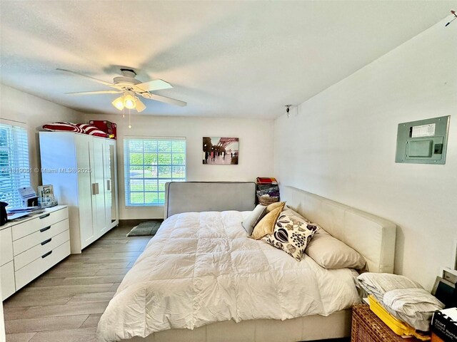 7650 SW 78th Ct, Miami, FL 33143 - bedroom featuring wood finished floors, electric panel, and a ceiling fan