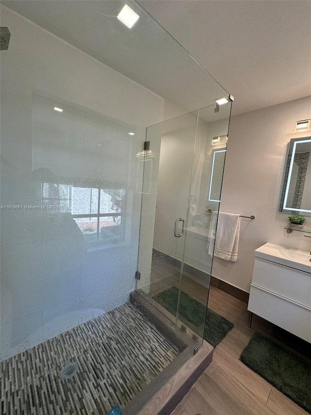 7650 SW 78th Ct, Miami, FL 33143 - full bathroom with a shower stall, vanity, and wood finished floors