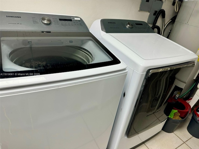7650 SW 78th Ct, Miami, FL 33143 - washroom with washing machine and clothes dryer and tile patterned floors