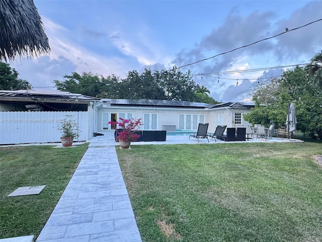 7650 SW 78th Ct, Miami, FL 33143 - rear view of property featuring a patio, solar panels, and french doors