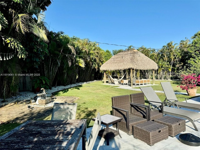 7650 SW 78th Ct, Miami, FL 33143 - view of green lawn with a gazebo and a patio area