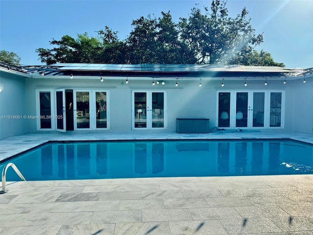7650 SW 78th Ct, Miami, FL 33143 - swimming pool featuring french doors and a patio