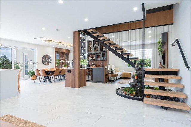 1828 Aspen Ln, Weston, FL 33327 - stairs featuring plenty of natural light, bar, and recessed lighting