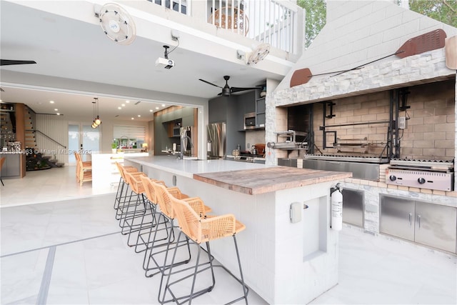 1828 Aspen Ln, Weston, FL 33327 - kitchen with a ceiling fan, decorative backsplash, modern cabinets, stainless steel fridge, and light countertops