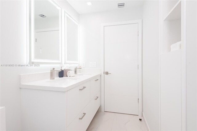 1828 Aspen Ln, Weston, FL 33327 - full bathroom with double vanity and marble look tiles