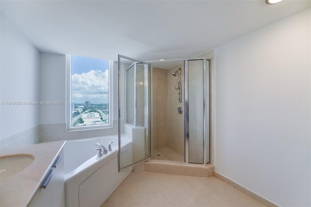 16699 Collins Ave Unit 2107, Sunny Isles Beach, FL 33160 - bathroom featuring a bath, tile patterned flooring, a stall shower, and vanity