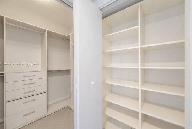 16699 Collins Ave Unit 2107, Sunny Isles Beach, FL 33160 - spacious closet with light tile patterned flooring